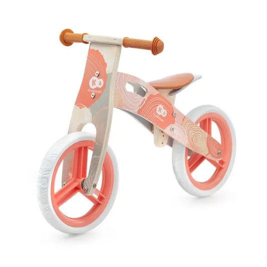 A pink and white balance bike with 12-inch EVA foam wheels and birch wood frame. Features safety handlebar lock, adjustable saddle, and parent-friendly carrying handle. Ideal for developing balance skills.
