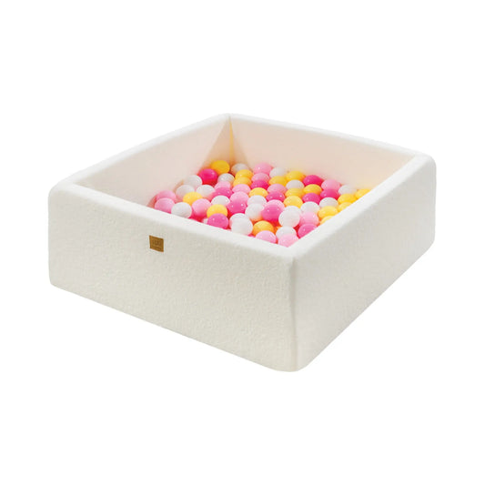 A white foam square ball pit filled with 200 pink, white, and yellow balls. Ideal for sensory therapy and motor skill development in toddlers. Made from soft, anti-allergic foam with washable, zip-fastened cover.
