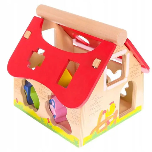 A wooden toy farmhouse shape sorter with animal-shaped holes for educational play, promoting shape and animal recognition, coordination, and imaginative learning for young children.