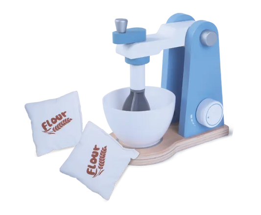 A wooden mixer set with a white bowl and two white bags, encouraging imaginative baking play for children. Compact dimensions of 16.2 x 9 x 17 cm.