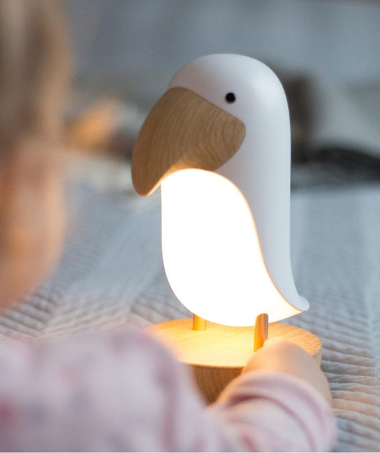 A small white bird-shaped lamp with speaker, ideal for children's rooms and bird lovers. Features wireless Bluetooth, adjustable brightness, and soothing night light for peaceful sleep.