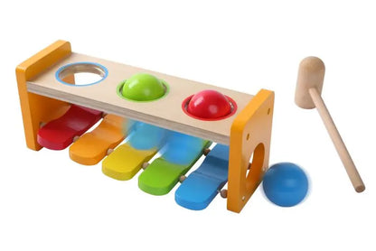 Wooden toy combining hammer bench and xylophone functions for interactive play and learning. Encourage creativity and skill development with Gerardo’s Toys 2-in-1 Musical Hammer Bench.