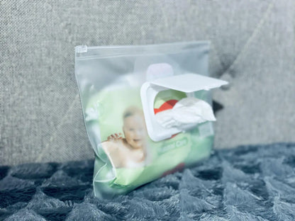 A plastic bag with a baby's picture on it, part of Ally Scandic's Baby Accessories Handbag – Black Coffee collection. Lightweight, versatile, and designed for on-the-go parents.