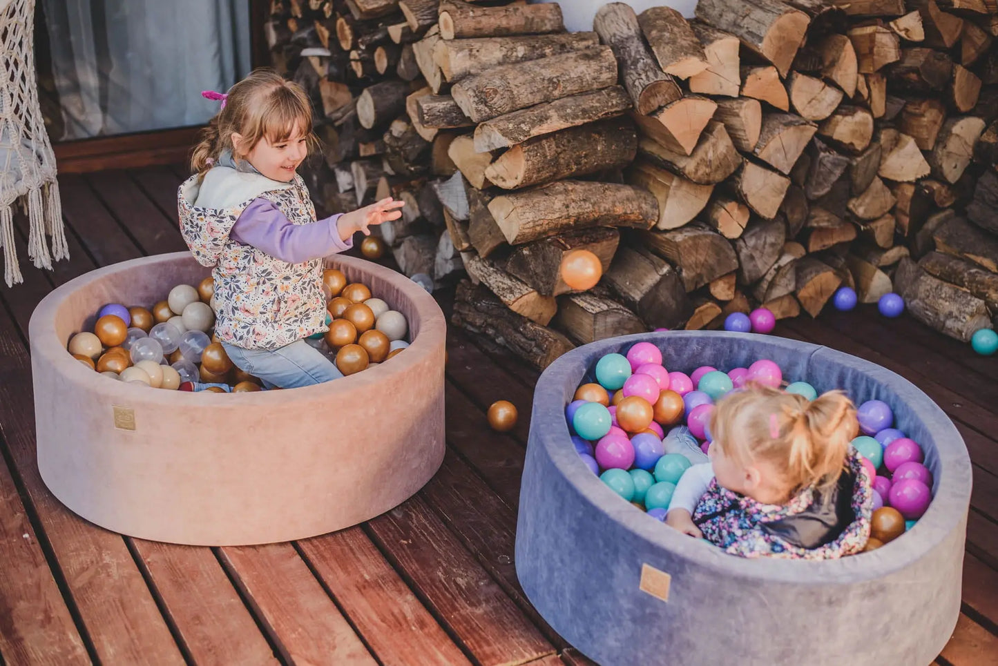 Child playing in MeowBaby® Baby Foam Ball Pit Model Flower, surrounded by colorful balls, promoting motor skills and sensory development. Sturdy foam construction, washable case, CE-certified safe balls included.