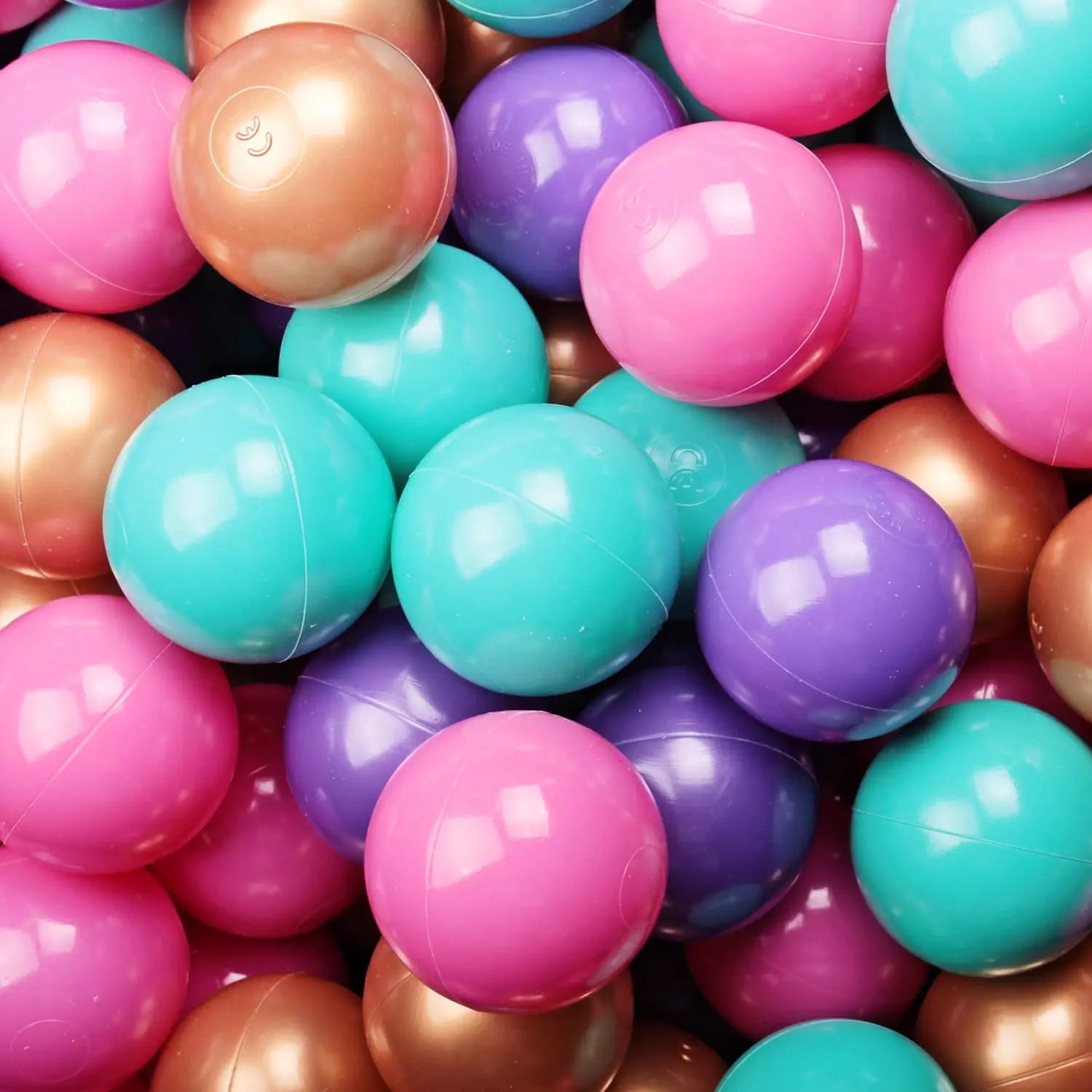 A close-up of a Baby Foam Ball Pit with colorful balls, ideal for sensory therapy and motor skills development, featuring stable foam construction and washable fabric case.