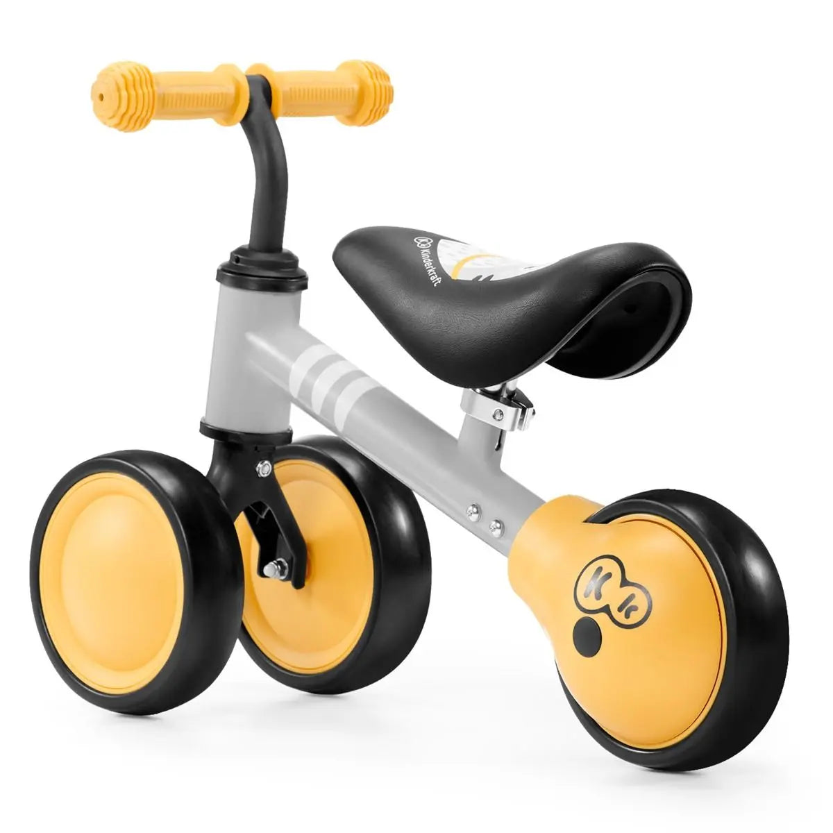 A yellow and black balance bike named CUTIE with kitten print, adjustable saddle, rubber handles, ball-bearing rear wheel, and sturdy steel frame.