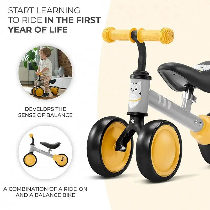 A black and yellow balance bike with yellow wheels, kitten print, adjustable saddle, rubber non-slip handles, ball-bearing rear wheel, and strong steel frame for safe and fun play.