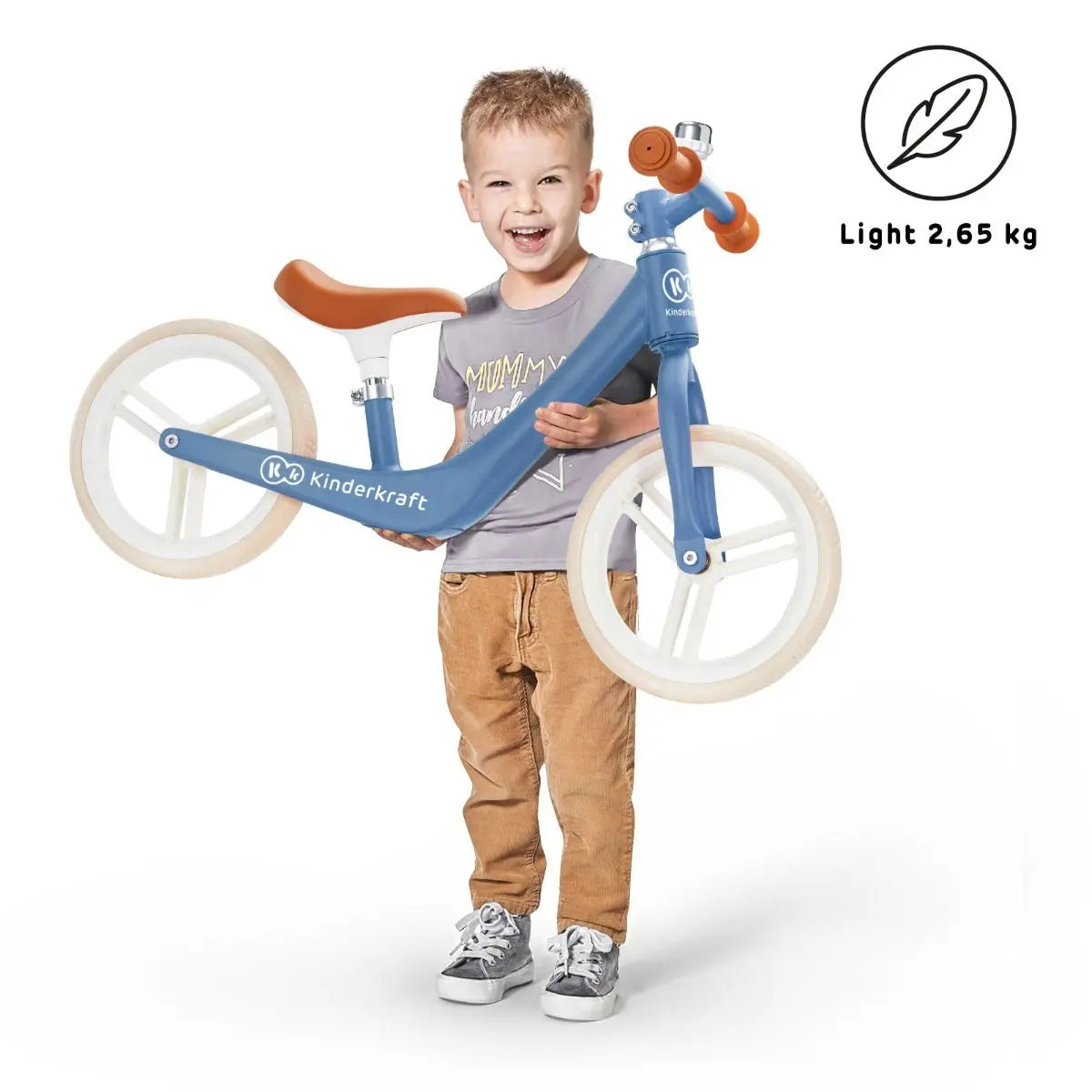 A boy holds the FLY PLUS balance bike with puncture-proof foam wheels, designed for ages 3 and up. Lightweight, retro-inspired, and safe for young riders.