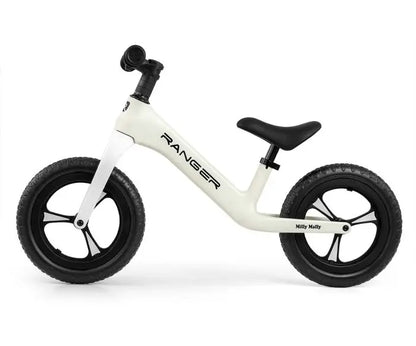 A white and black balance bike for young explorers, the Milly Mally Ranger features adjustable seat height, bearing-mounted steering, lightweight frame, slip-resistant handles, soft seat, and 12-inch puncture-proof wheels.