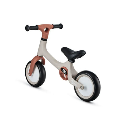 A close-up of the TOVE balance bike showcasing its puncture-resistant wheels, durable construction, adjustable seat, and two carry handles for easy transport.