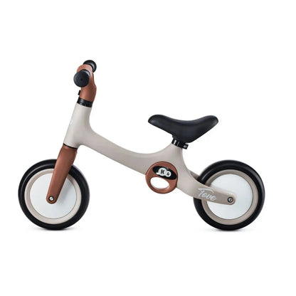 A lightweight TOVE balance bike with puncture-resistant foam wheels, adjustable seat, and two carry handles for children aged 18 months and up.