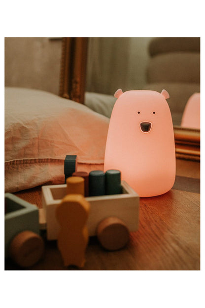 A pink silicone Big Bear lamp with remote control, safe for children, soft to touch, with LED technology, multifunctional, and award-winning.