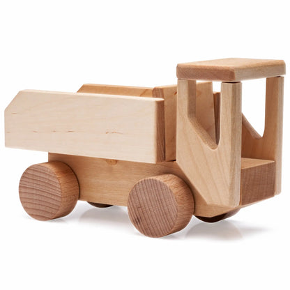 A wooden DIY truck set named Villi, featuring wheels and wooden blocks. Encourages hands-on learning, creativity, and problem-solving for children aged 3+. Crafted from birchwood in Europe for durability.