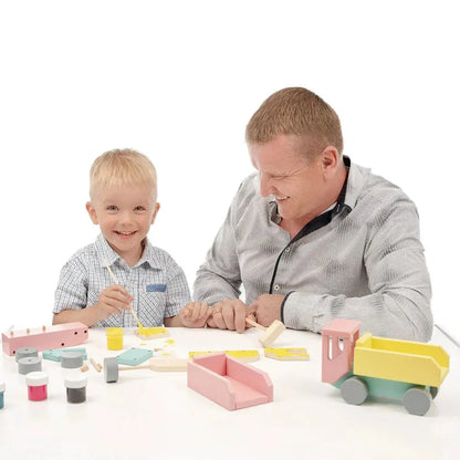 A man and boy assemble a DIY Wooden Truck set, engaging in hands-on learning and play. Meet Villi, the wooden constructor truck fostering creativity and problem-solving skills for children aged 3 and above.