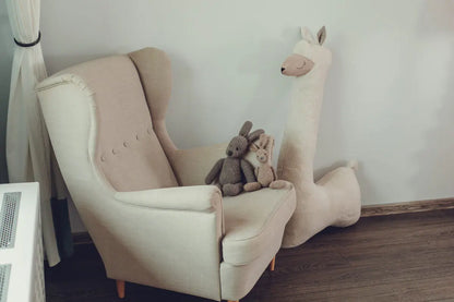 A handmade Giant Plush Toy Alpaca in Beige, 1 meter x 20 centimeters, with super soft vegan fur, eco-friendly materials, and CE safety declaration.