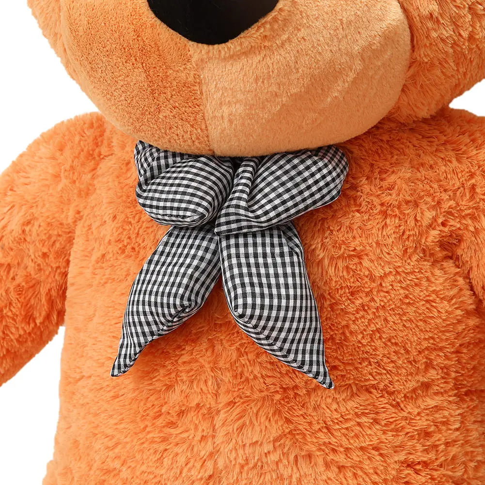 A close-up of a Giant Teddy Bear - 180 cm, featuring soft fur and a checkered bow. Safe for hugging, washable, and EU certified. Perfect for joyful cuddling moments.