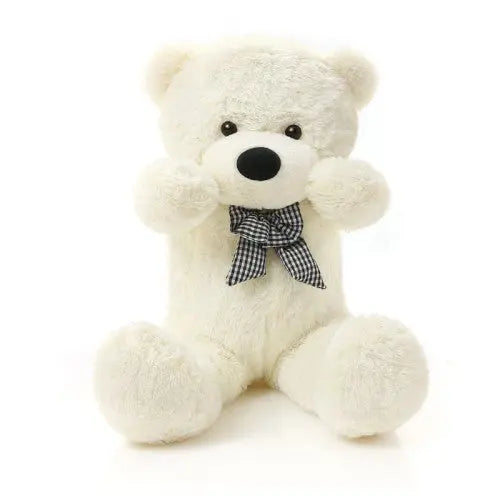 A giant 180 cm TEDDY Bear with a black and white checkered bow, made from soft fur. EU safety certified, washable, and crafted for safe hugging and cuddling moments.