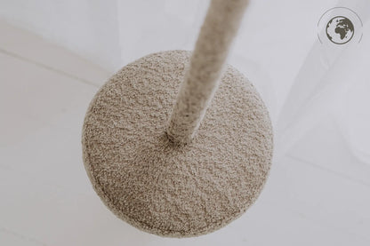 Close-up of HopOn Swing - Bouclé Sand, featuring a sturdy pole with cotton rope, ideal for indoor use. OEKO-TEX certified materials, 31 cm seat, 2.5 m rope, 100 kg capacity.