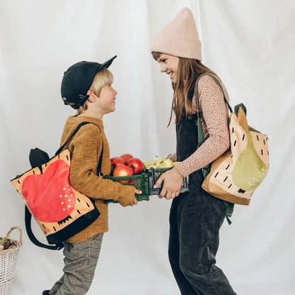 Kids backpack featuring an apple motif, perfect for young adventurers. Velvet top with apple design, waterproof polyester bottom, adjustable straps, and zipper closure. Ideal for ages 2-6.