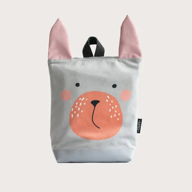 A kids backpack featuring a bunny design, perfect for wild adventures. Made of velvet and waterproof polyester, with adjustable straps and zipper closure. Size: 30cm height, 26cm width.