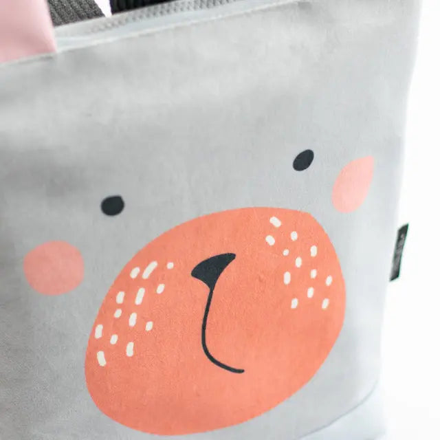 Close-up of a Bunny kids backpack with velvet top featuring a Bunny design, waterproof orange bottom, beige shoulder straps, and zipper closure. Ideal for 2-6-year-olds on adventurous park outings.