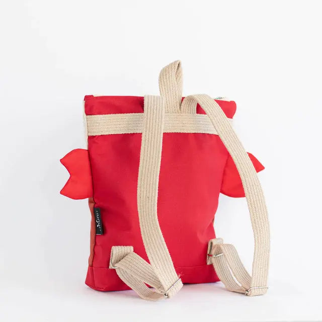 A toddler-friendly backpack featuring a red and tan design with a white strap. CRAB backpack for kids, made of velvet and waterproof polyester, with adjustable shoulder straps and zipper closure.