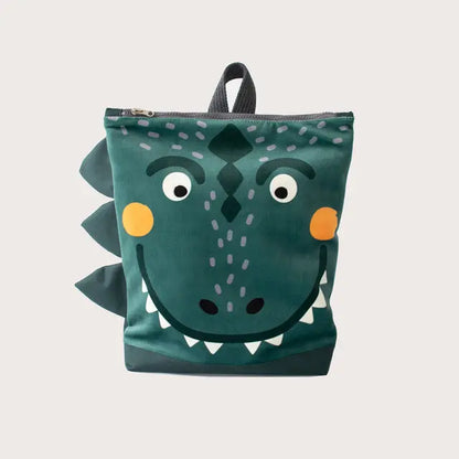 Kids backpack featuring a green bag with a dinosaur face design. Ideal for young adventurers, with velvet and waterproof polyester materials, adjustable straps, and ample storage space.