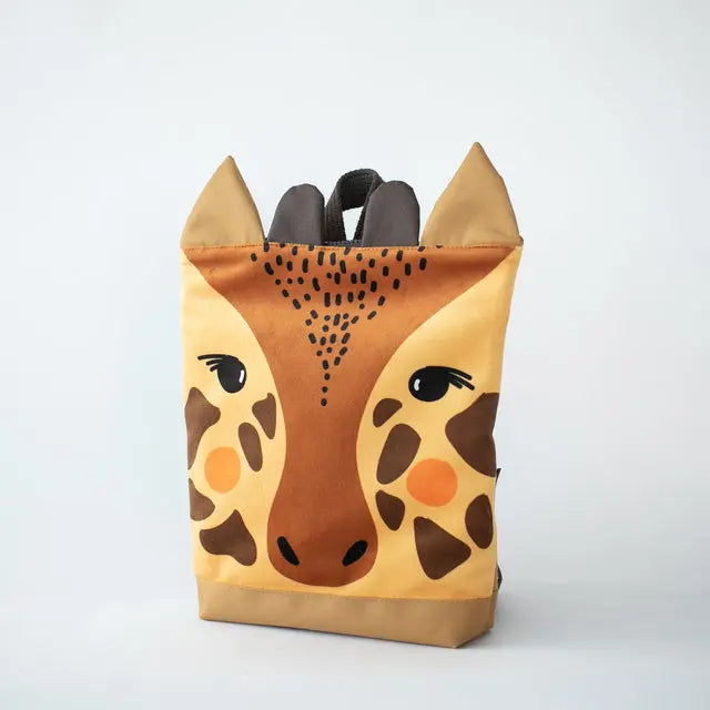 A kids backpack featuring a giraffe face design, made of velvet and waterproof polyester. Two sizes available: Small (29x26cm) and Large (35x30cm). Ideal for outdoor adventures.