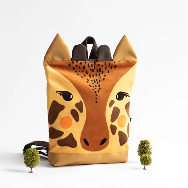 A kid's backpack featuring a giraffe design, with a velvet top and waterproof polyester bottom. Adjustable beige shoulder straps, zipper closure, and two slip pockets inside. Two size options available.