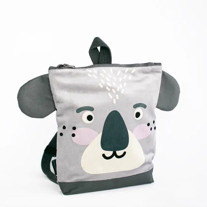 Kids backpack featuring a grey koala face design. Made of velvet and waterproof polyester with adjustable shoulder straps. Ideal for outdoor adventures with a playful touch. Dimensions vary for different age groups.