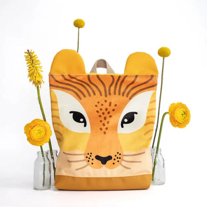 A lion-themed kids backpack featuring a lion face design, velvet top, and waterproof polyester bottom. Includes adjustable shoulder straps, zipper closure, and inner slip pockets. Dimensions vary.