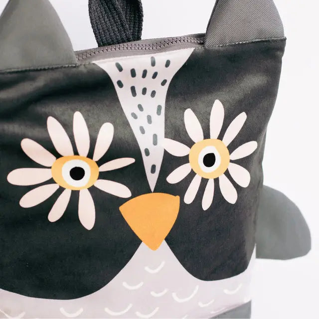 A cartoon owl-themed kids backpack with adjustable straps, zipper closure, and slip pockets. Available in small (2-5 years) and large (4-10 years) sizes. Ideal for preschool adventures.