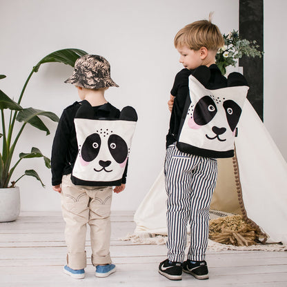 Kids backpack - Panda, worn by a child, features a plush panda design with adjustable straps, suitable for outdoor adventures and nature hikes.