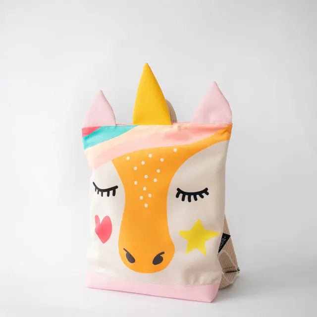 A kids backpack featuring a unicorn face design, velvet top, sturdy polyester bottom, adjustable straps, and zipper closure. Available in small and large sizes.