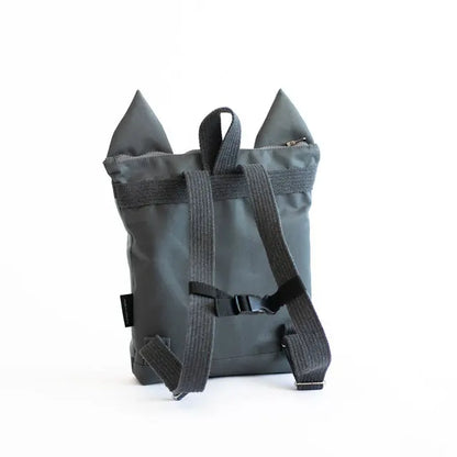 A grey kids backpack with wolf design, velvet top, and sturdy polyester bottom. Adjustable straps, zipper closure, and slip pockets. Ideal for young explorers aged 3-9.