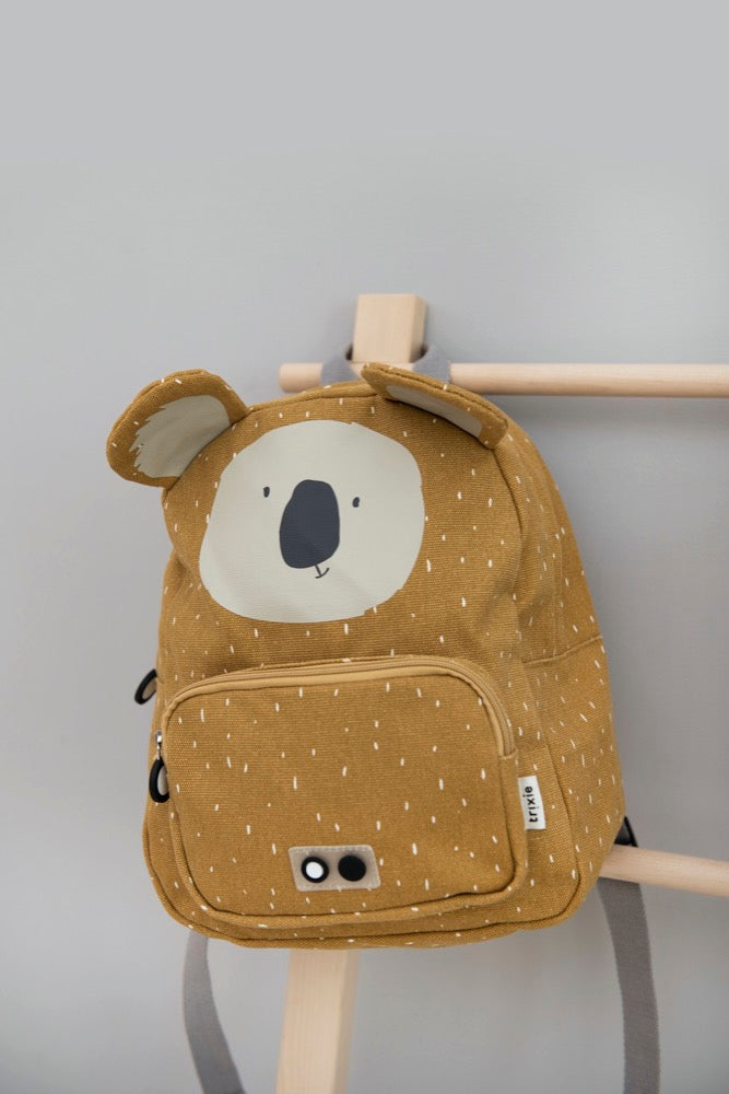 A backpack featuring Mr Koala design, ideal for kids' adventures. Adjustable padded straps, chest strap, water-repellent cotton material, 7.5L capacity, and playful front pocket for snacks.