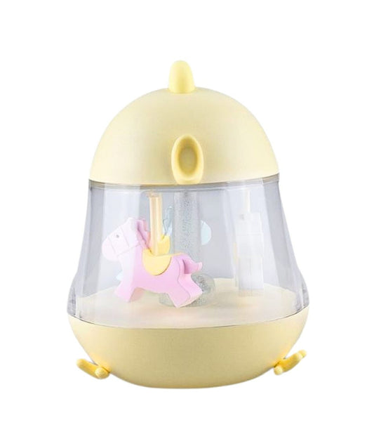 A yellow and white toy lamp with carousel and music box. Features include merry-go-round horses, 7-color lighting, and 12-hour illumination. Dimensions: 15.4 x 12.6 x 11.4 cm.