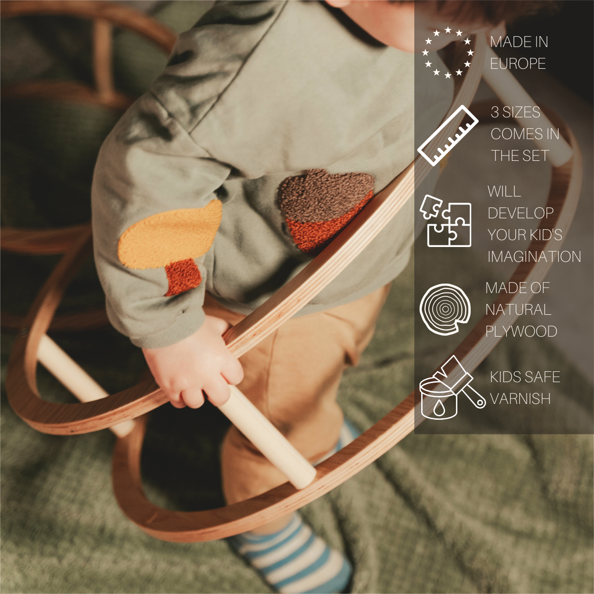 Child playing with Montessori Toy Rings, holding a wooden ring from the set designed for skill development, featuring three stackable sizes to enhance fine motor skills.