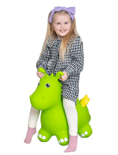 A girl joyfully rides a green dragon toy resembling a Batmobile. Develops balance and coordination skills, suitable for indoor and outdoor play. Birth certificate included for personalization.