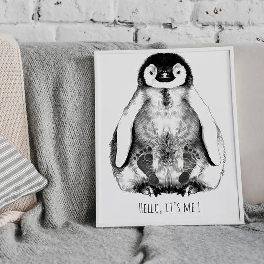 A hand-drawn baby penguin footprint kit with two A3 drawings, a white wooden frame, and a baby-safe inkpad. Ideal for capturing your little one's feet in a personalized and artistic way.