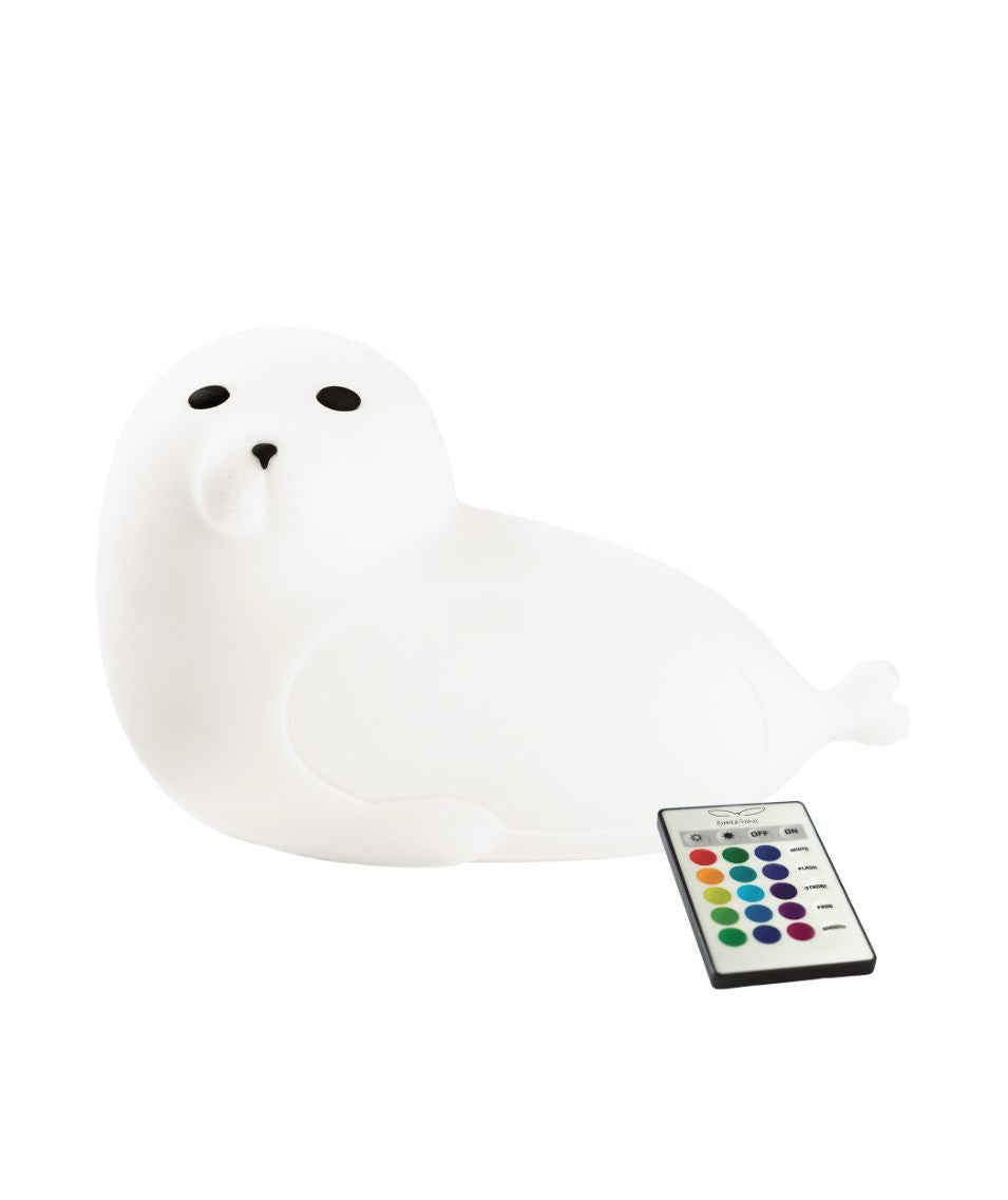 White seal-shaped lamp with remote control, soft silicone texture, and multifunctional features like 7 color lights, auto-off, and USB-C charging. Safe, playful, and perfect for kids' peaceful nights.