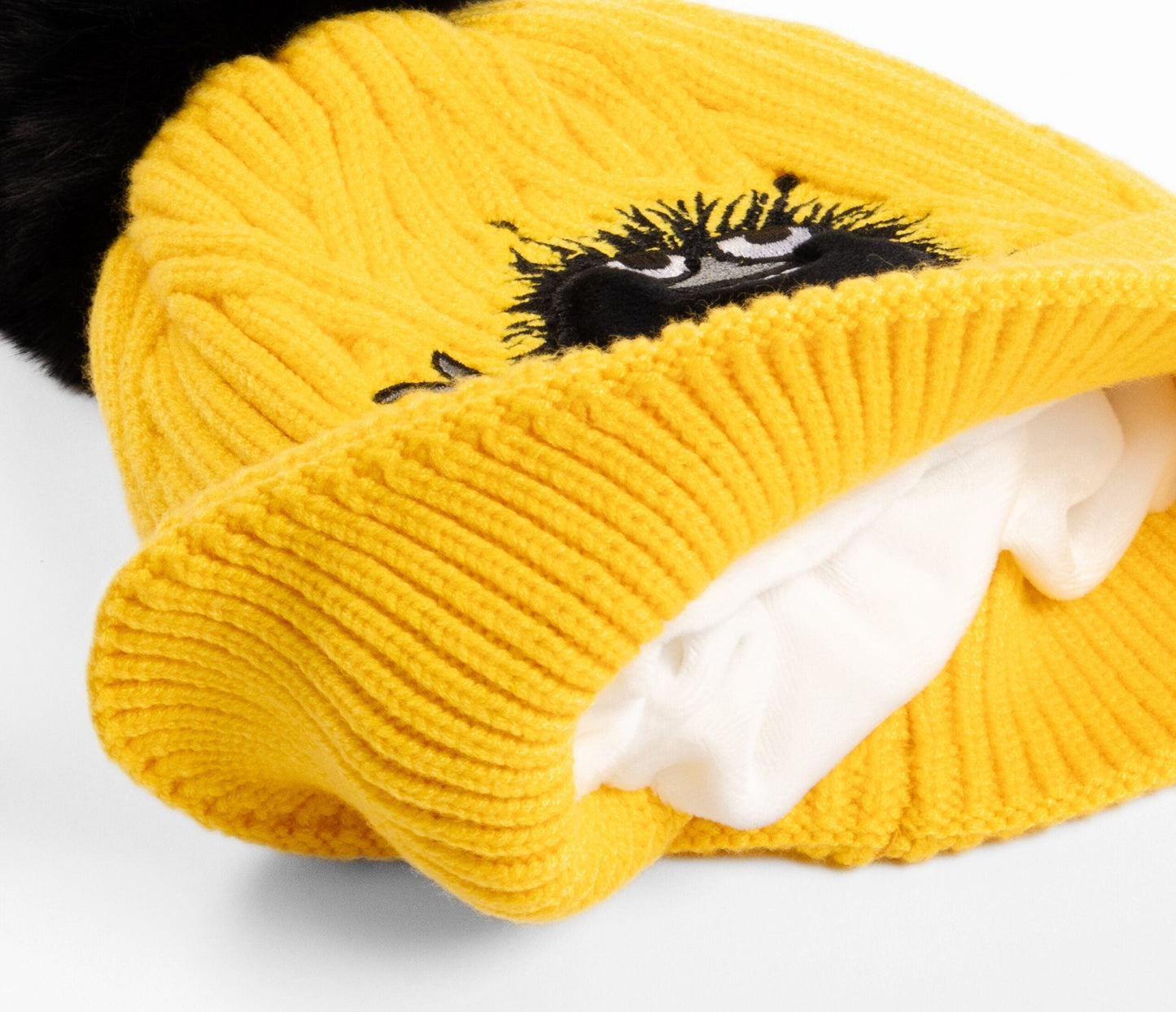 Stinky Winter Beanie Kids - Yellow, featuring a yellow knit design with super soft fleece inside, crafted from 100% acrylic for flexibility and comfort.