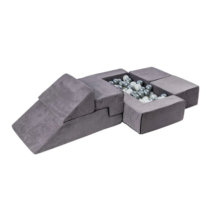 A versatile Velvet Bricks Set for children's play, featuring soft blocks for safe and creative configurations like a sofa or ball pit. Ideal for active play and learning.