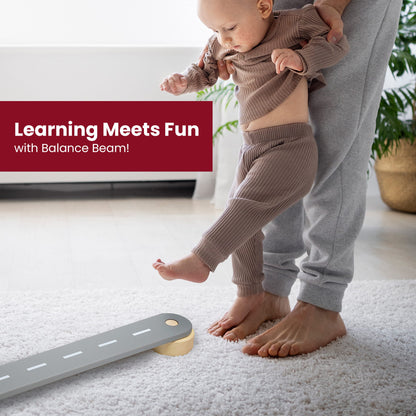 Wooden Balance Beam - 6 Elements: A baby stands on a person's leg near the balance beam, highlighting its use for developing balance and learning.