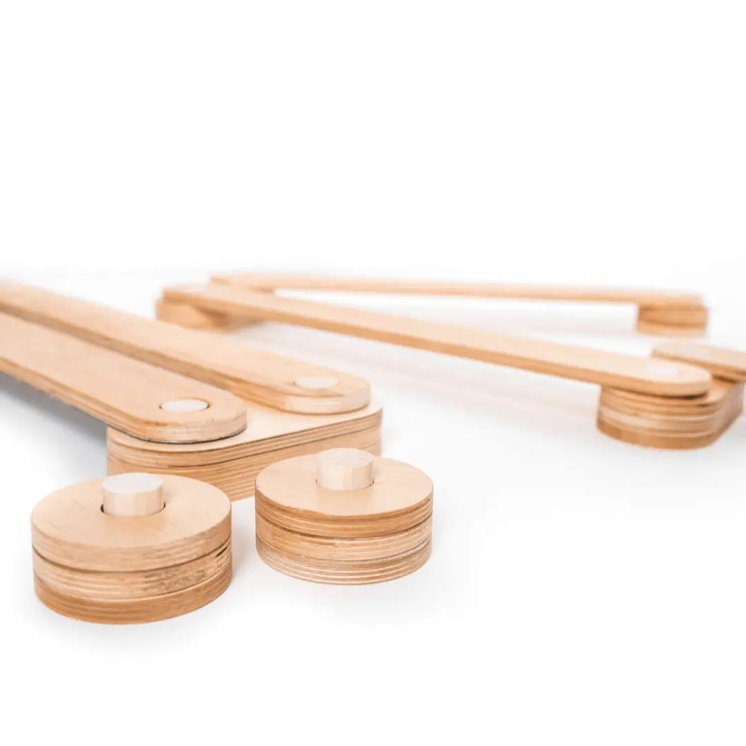 Wooden Balance Beams for child's growth and play. Set includes beams and connectors. Safe, high-quality plywood. Enhances balance, motor skills, and creativity. Made in Europe.