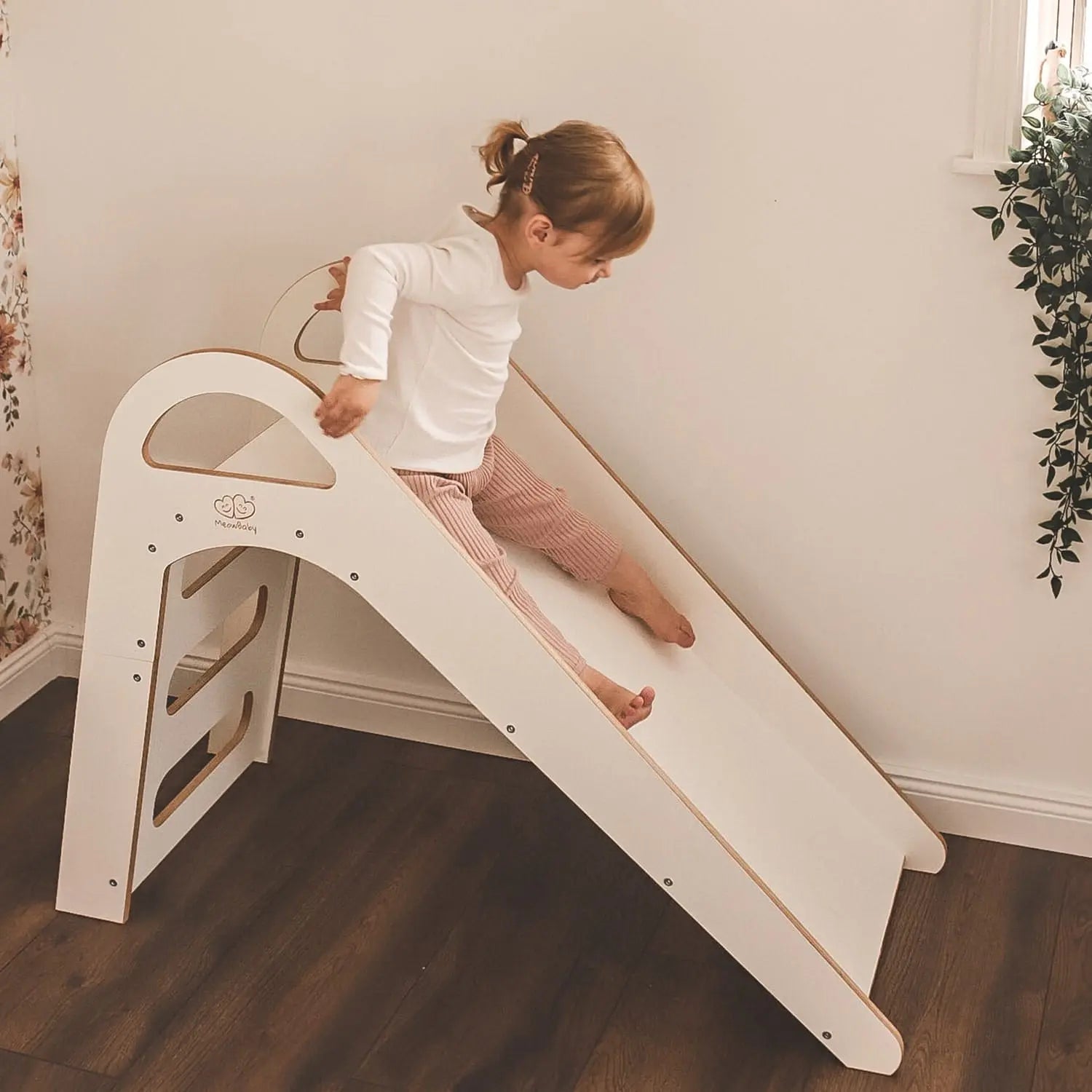 Child on Wooden Indoor Scandi Slide, 87x46cm, climbing steps with handles, smooth edges for safety, promoting motor skills and balance.