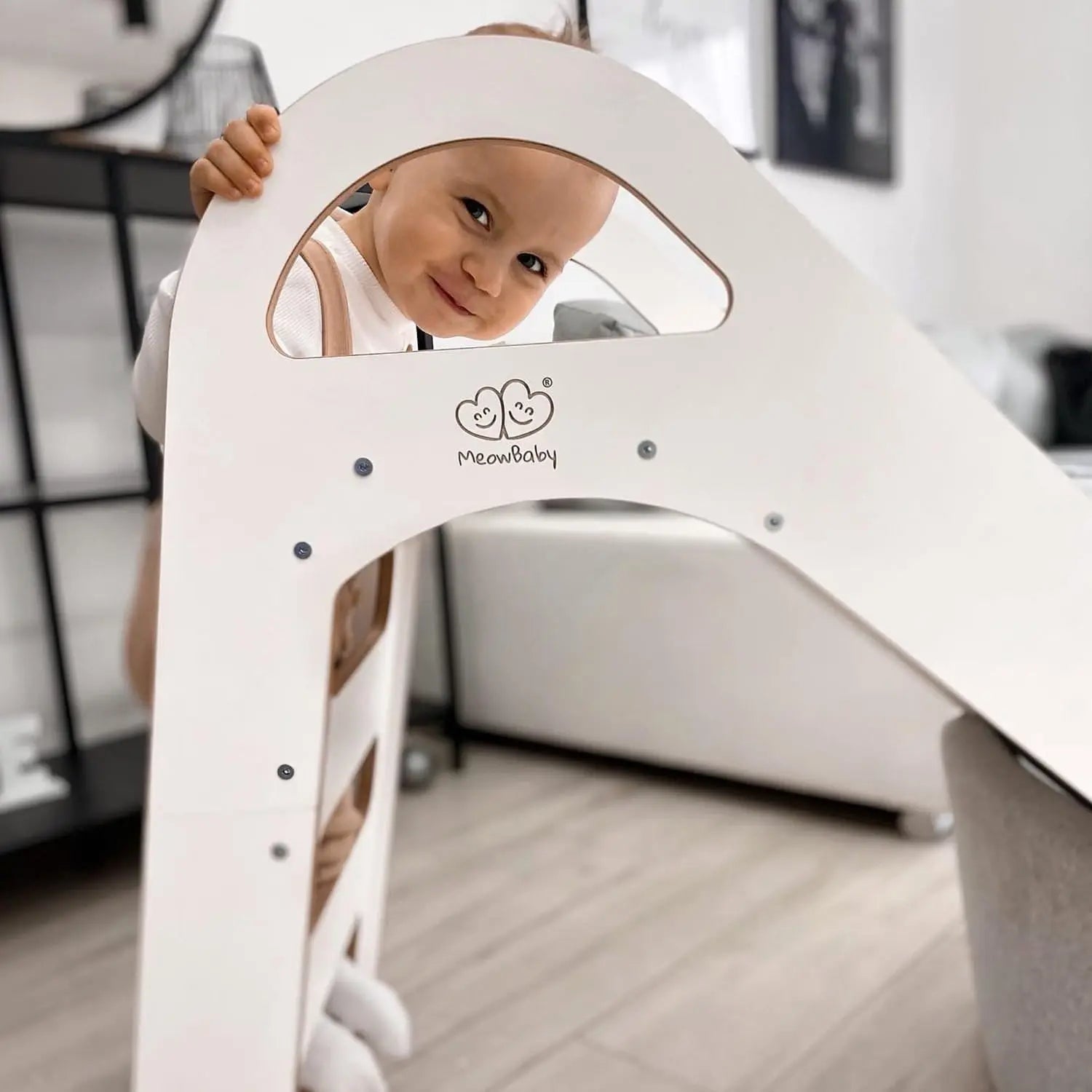 Child smiling on Wooden Indoor Scandi Slide, 87x46cm, with stable structure, 3 steps, and comfortable handles for safe play. Ideal for kids over 12 months.