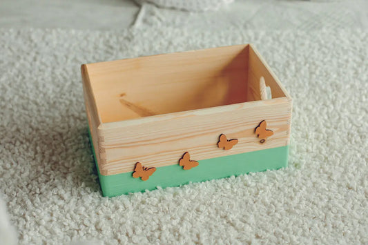 Handmade wooden storage box with cut out hearts on both sides, featuring golden butterflies. Ideal for keepsakes and gifts. Size: 20 x 30 x 13 cm.