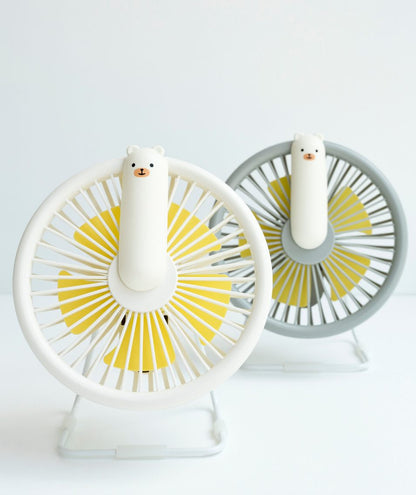 Portable white and yellow fan with polar bear design, adjustable speed levels, micro USB charging, and built-in lamp. Ideal for cooling on hot days and nights.