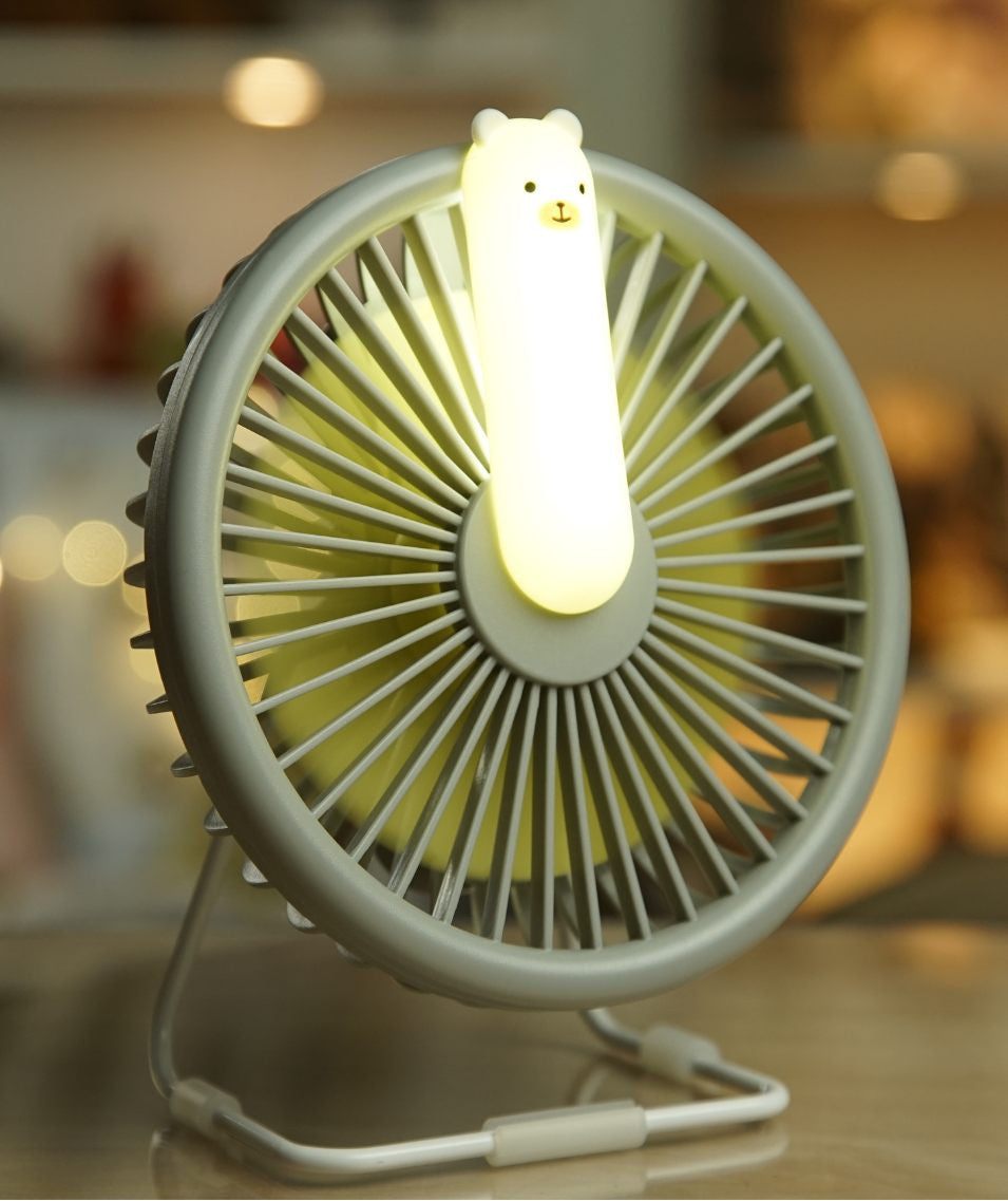 Portable Little Bear Fan Lamp with adjustable airflow, USB charging, and built-in light. Perfect for cooling on hot days and nights. Dimensions: 15.4 x 14.5 x 7.6 cm.